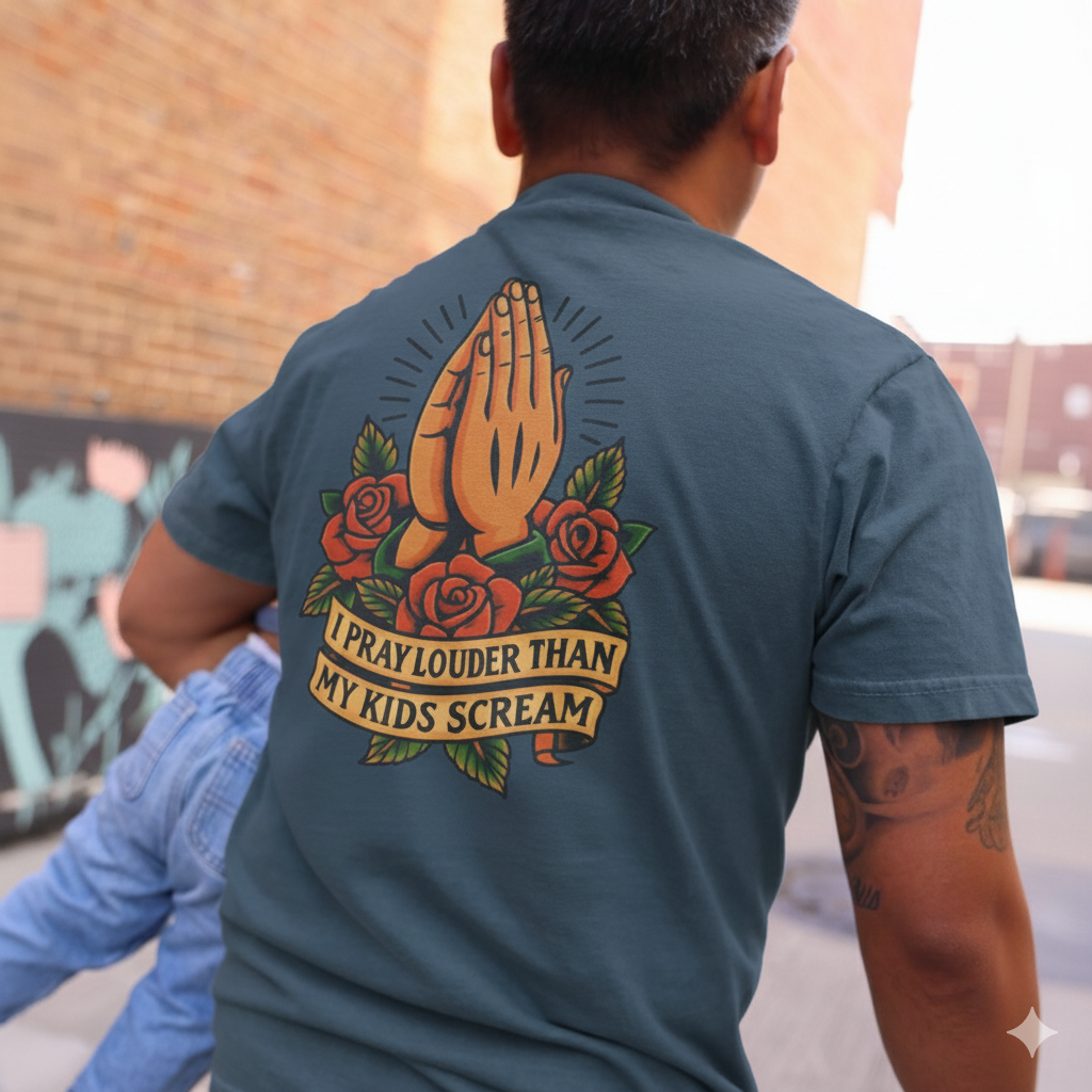 Person wearing a t-shirt with a graphic design on the back, featuring hands and roses.